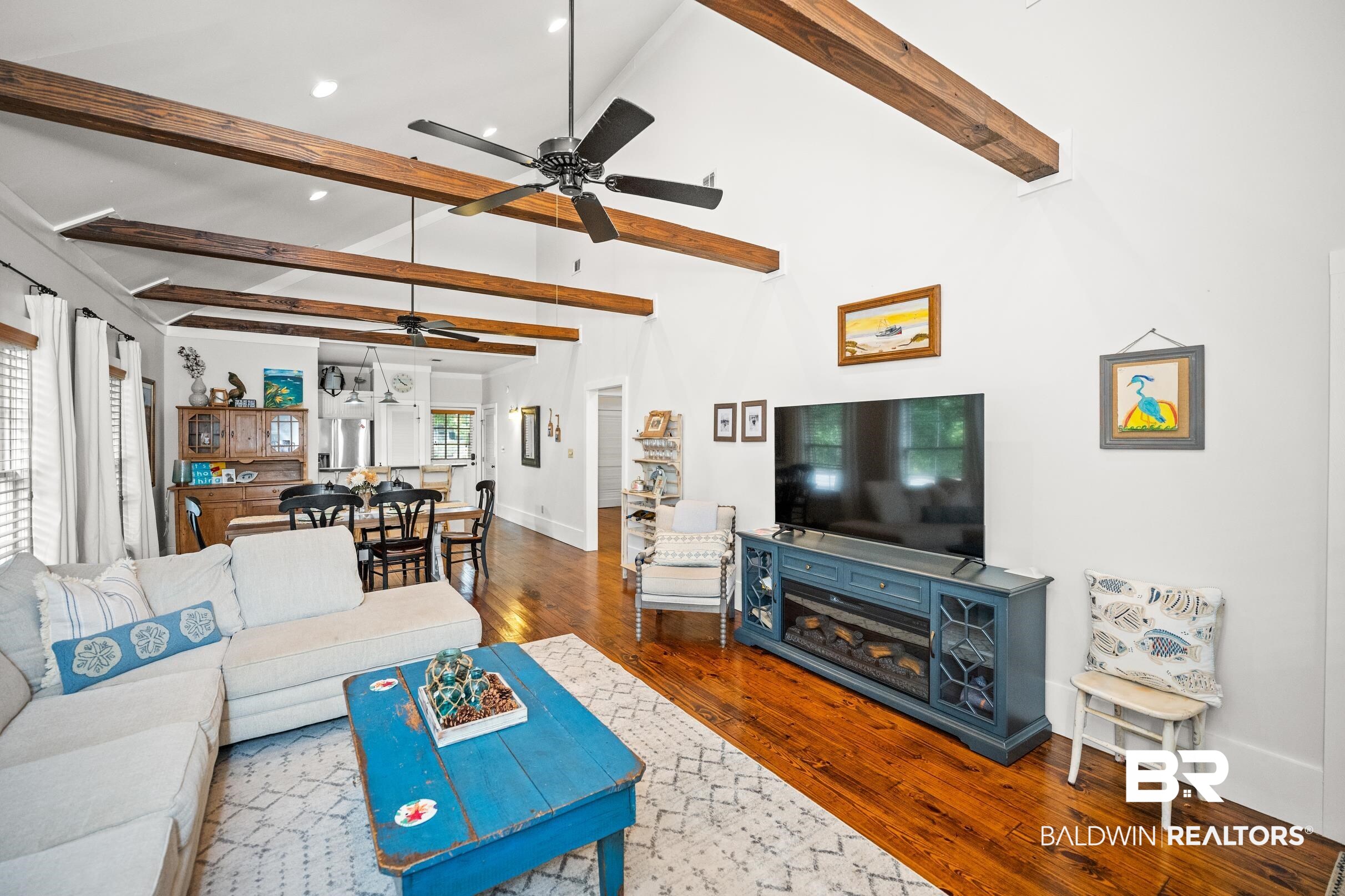 25773 Canal Road, Unit 18 Orange Beach, AL 36561 - Photo 7 of 44 Living room featuring beam ceiling, wood-type flooring, recessed lighting, and high vaulted ceiling