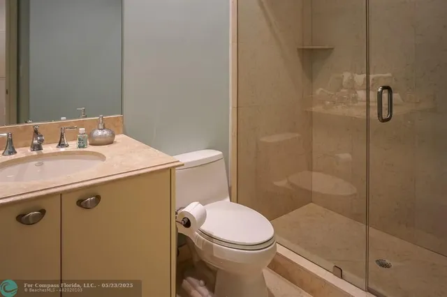 a bedroom with a bed and a lamp