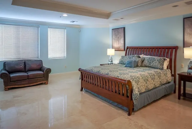 a bed room with a bed and a couch