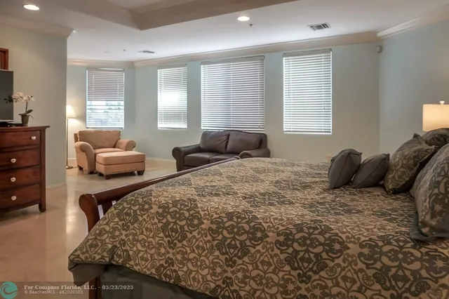 a bed room with a bed and a couch