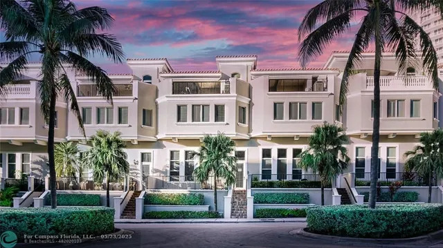 a balcony with table and chairs