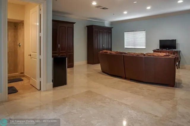 a living room with furniture window and a flat screen tv