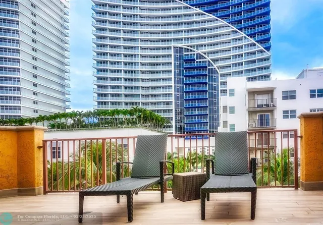 a view of a balcony with a potted plants