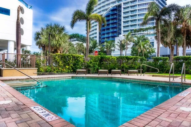 a view of swimming pool from a garden