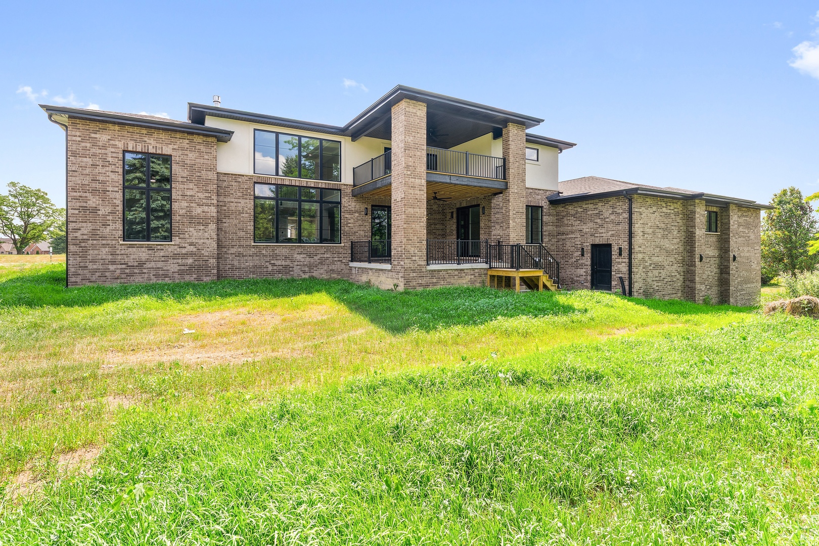 a view of a house with a yard and sitting area