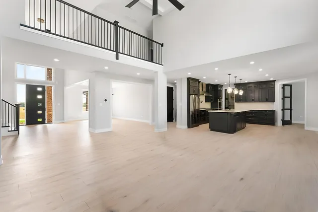 a view of a kitchen with a sink and a stove top oven