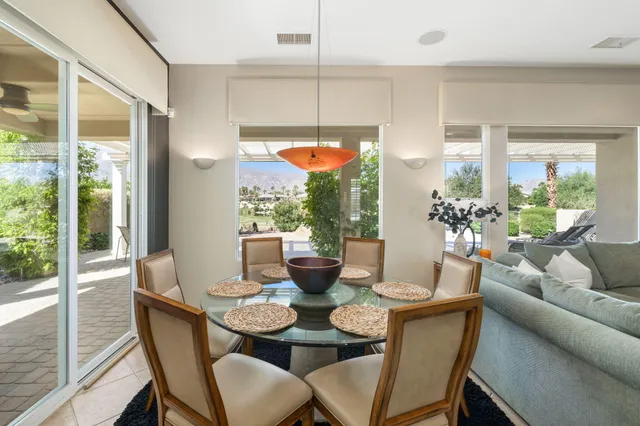 a en suite bathroom with a double vanity sink a mirror and shower