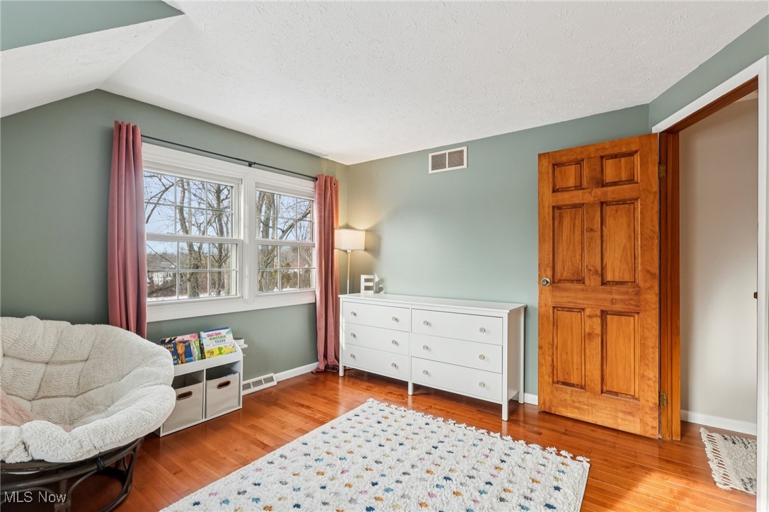 445 Center Road Hinckley, OH 44233 - Photo 27 of 50 Sitting room featuring light wood-style flooring and a textured ceiling