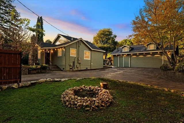 a front view of a house with a garden