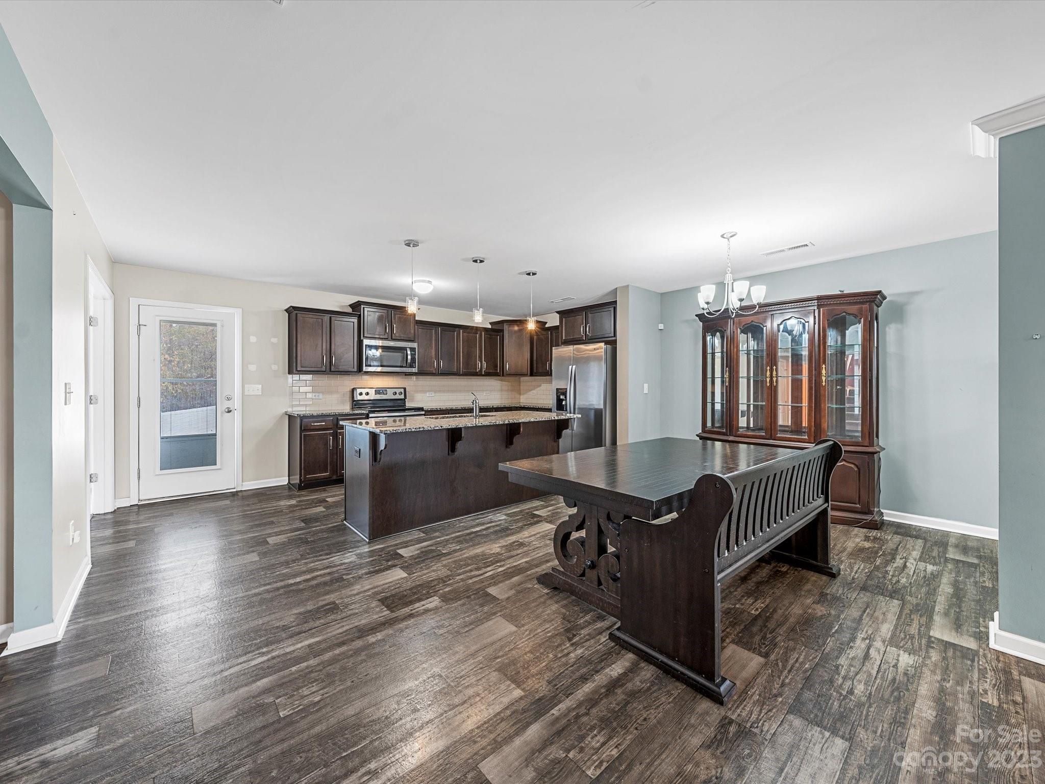 1142 Whitehall Hill Road York, SC 29745 - Photo 11 of 43 a living room with kitchen island furniture and kitchen view