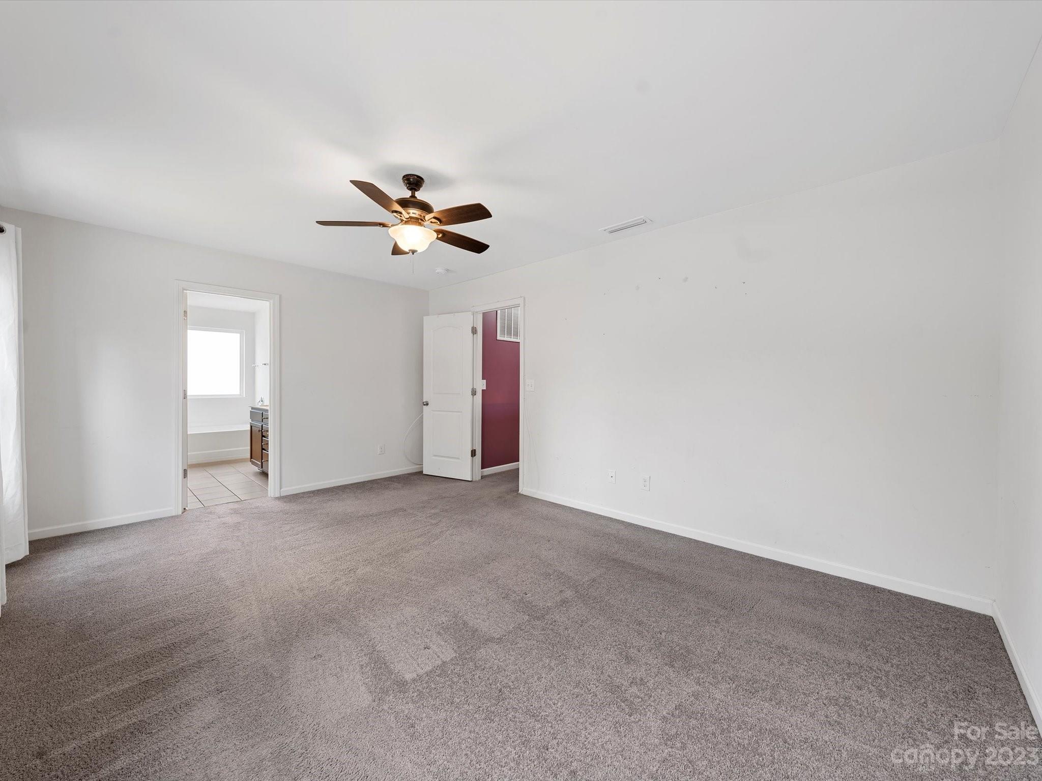 1142 Whitehall Hill Road York, SC 29745 - Photo 24 of 43 an empty room with a ceiling fan and a window