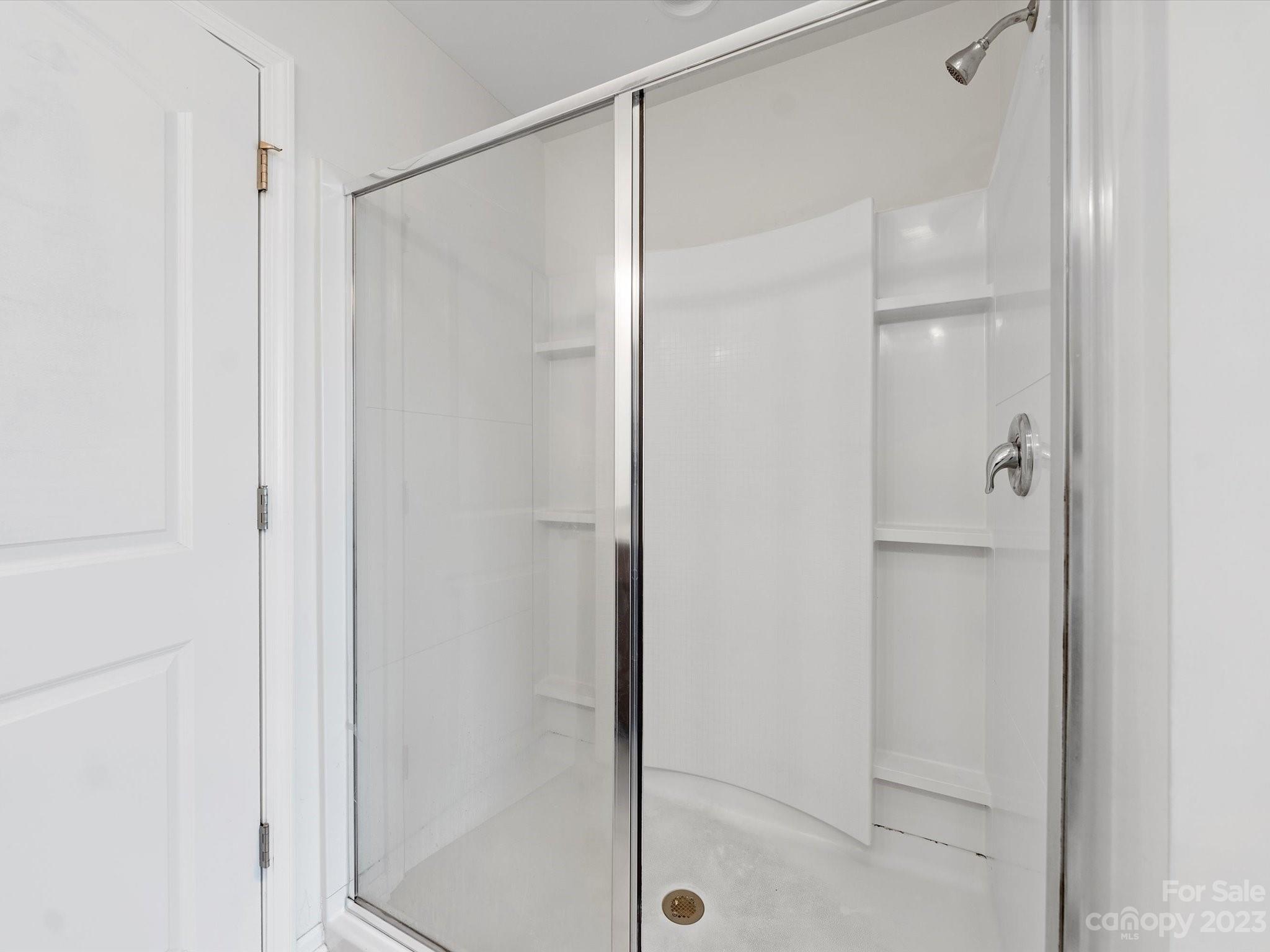 1142 Whitehall Hill Road York, SC 29745 - Photo 25 of 43 a bathroom with a glass shower door