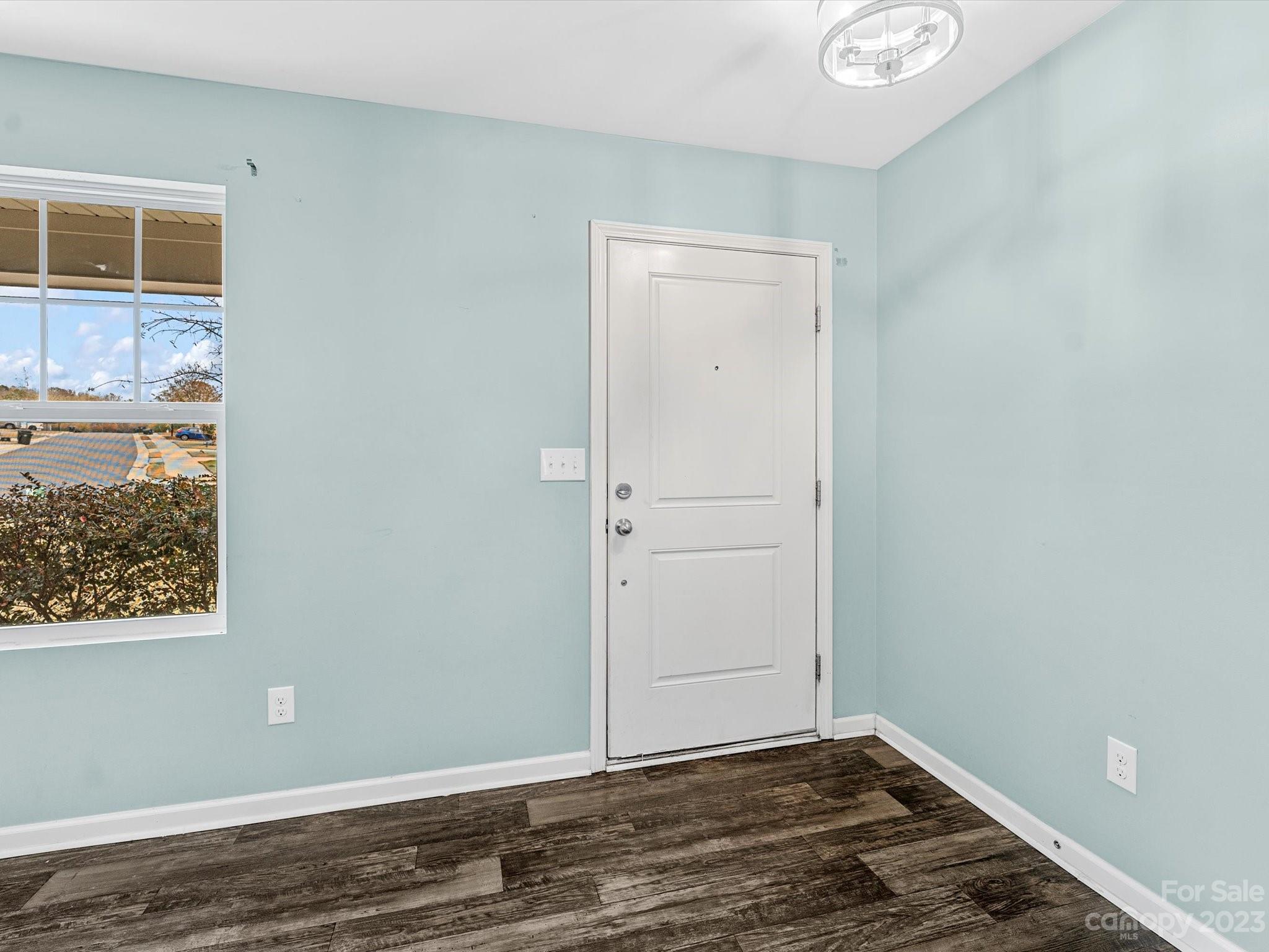 1142 Whitehall Hill Road York, SC 29745 - Photo 7 of 43 a view of an empty room with wooden floor and a window