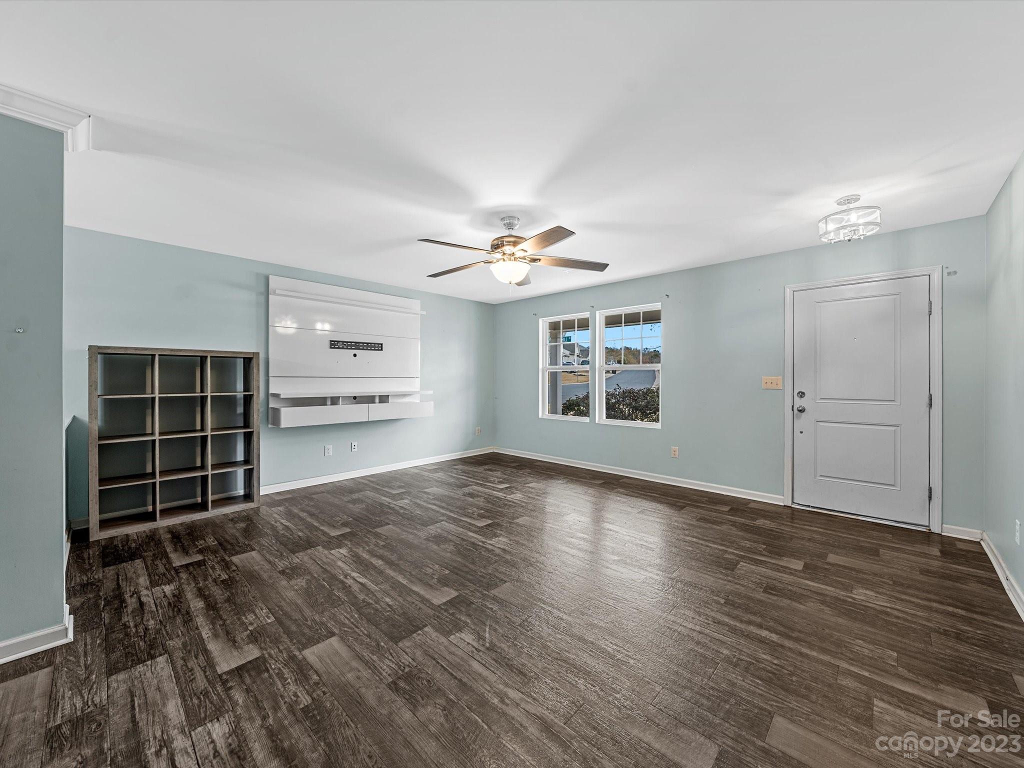 1142 Whitehall Hill Road York, SC 29745 - Photo 8 of 43 a view of an empty room with a window and wooden floor