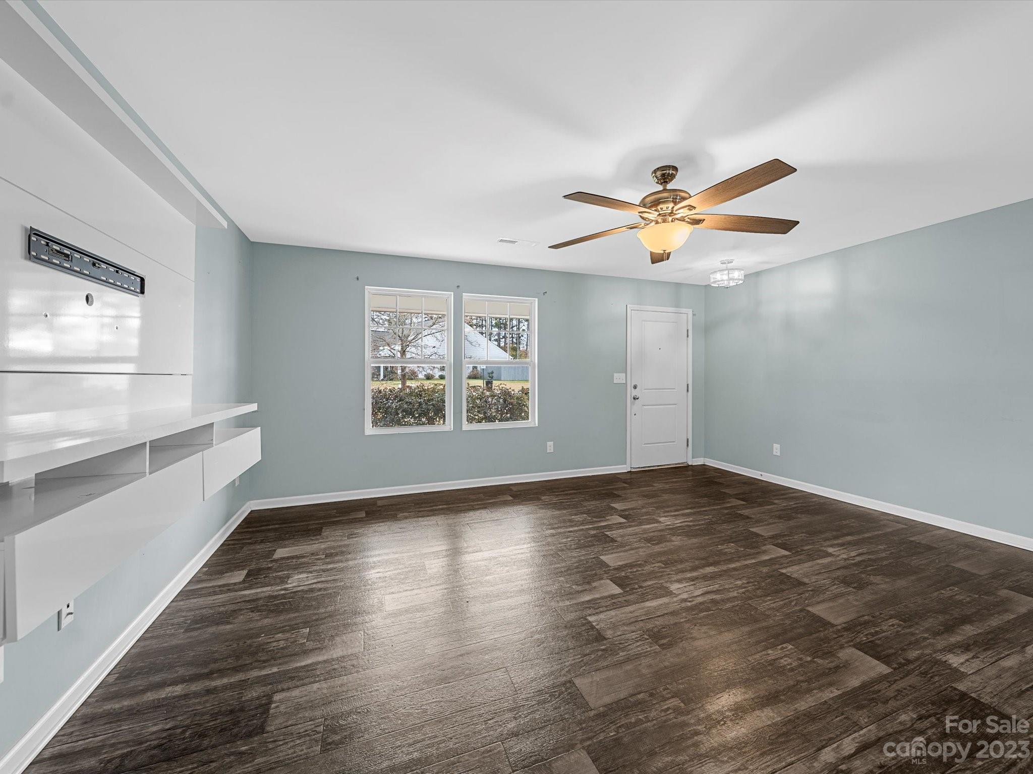1142 Whitehall Hill Road York, SC 29745 - Photo 9 of 43 wooden floor in an empty room with a window