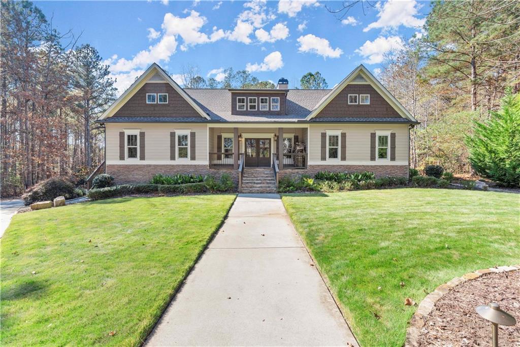 a front view of a house with yard