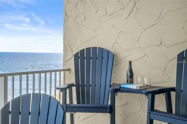 a view of balcony with furniture