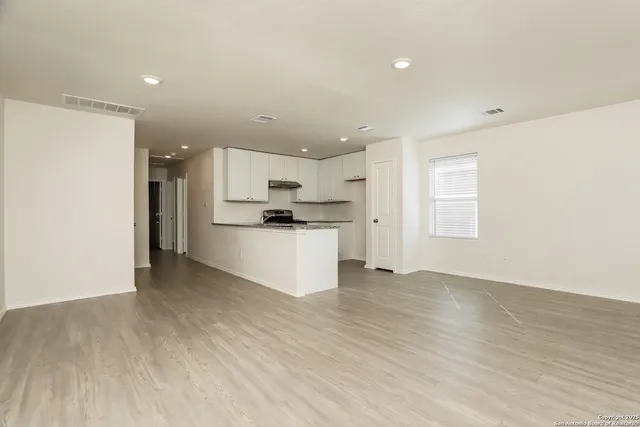 a view of kitchen with wooden floor