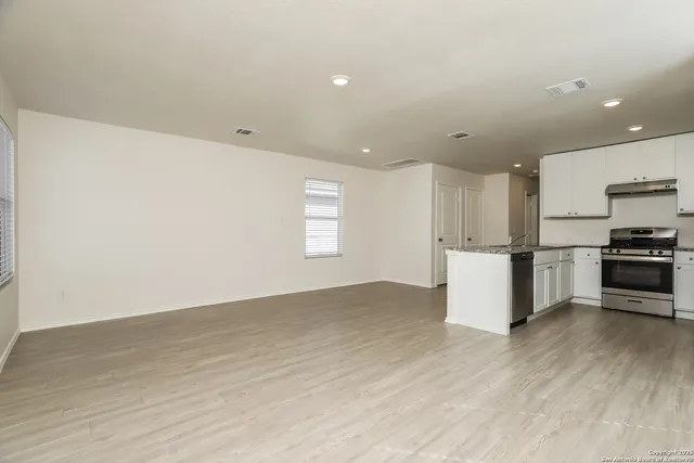 a view of kitchen with wooden floor