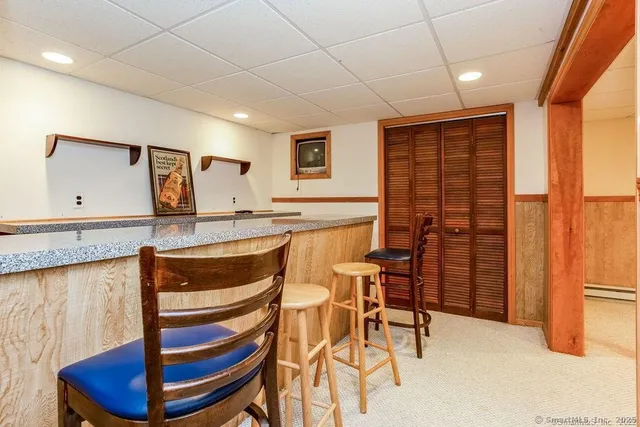 a view of hall way with furniture and window