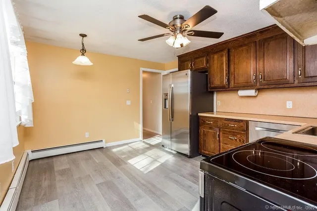 a kitchen with a stove and a refrigerator