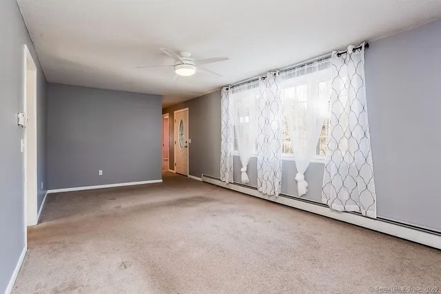 a view of an empty room with a window