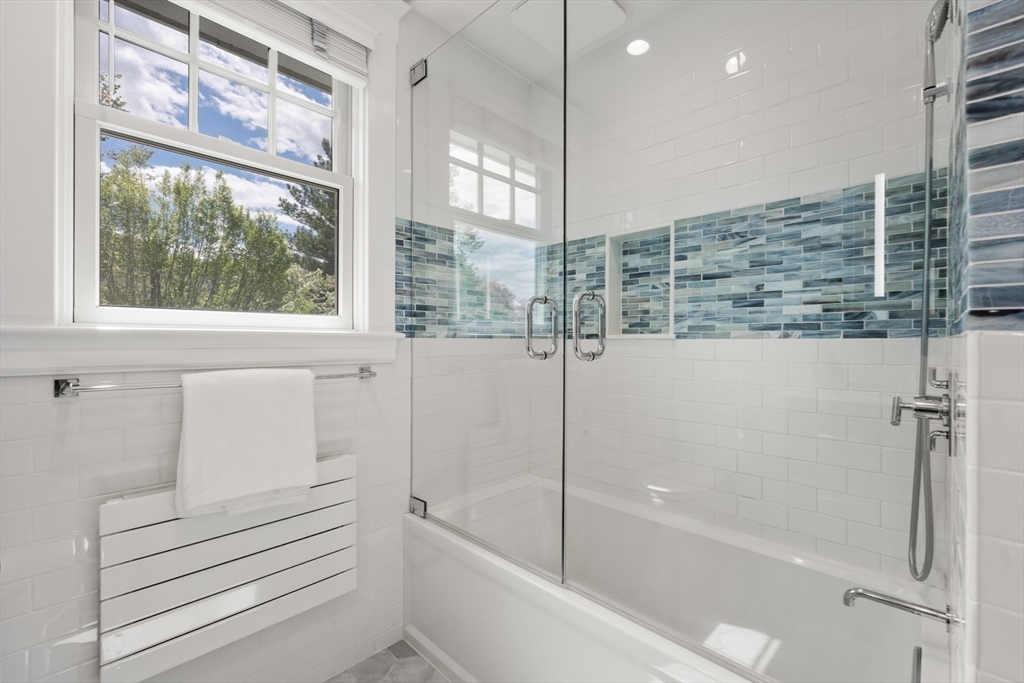 8 Charlotte Road Marblehead, MA 01945 - Photo 22 of 37 a bathroom with a bathtub and a shower