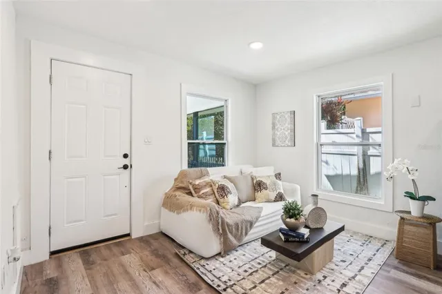 a living room with furniture and a window