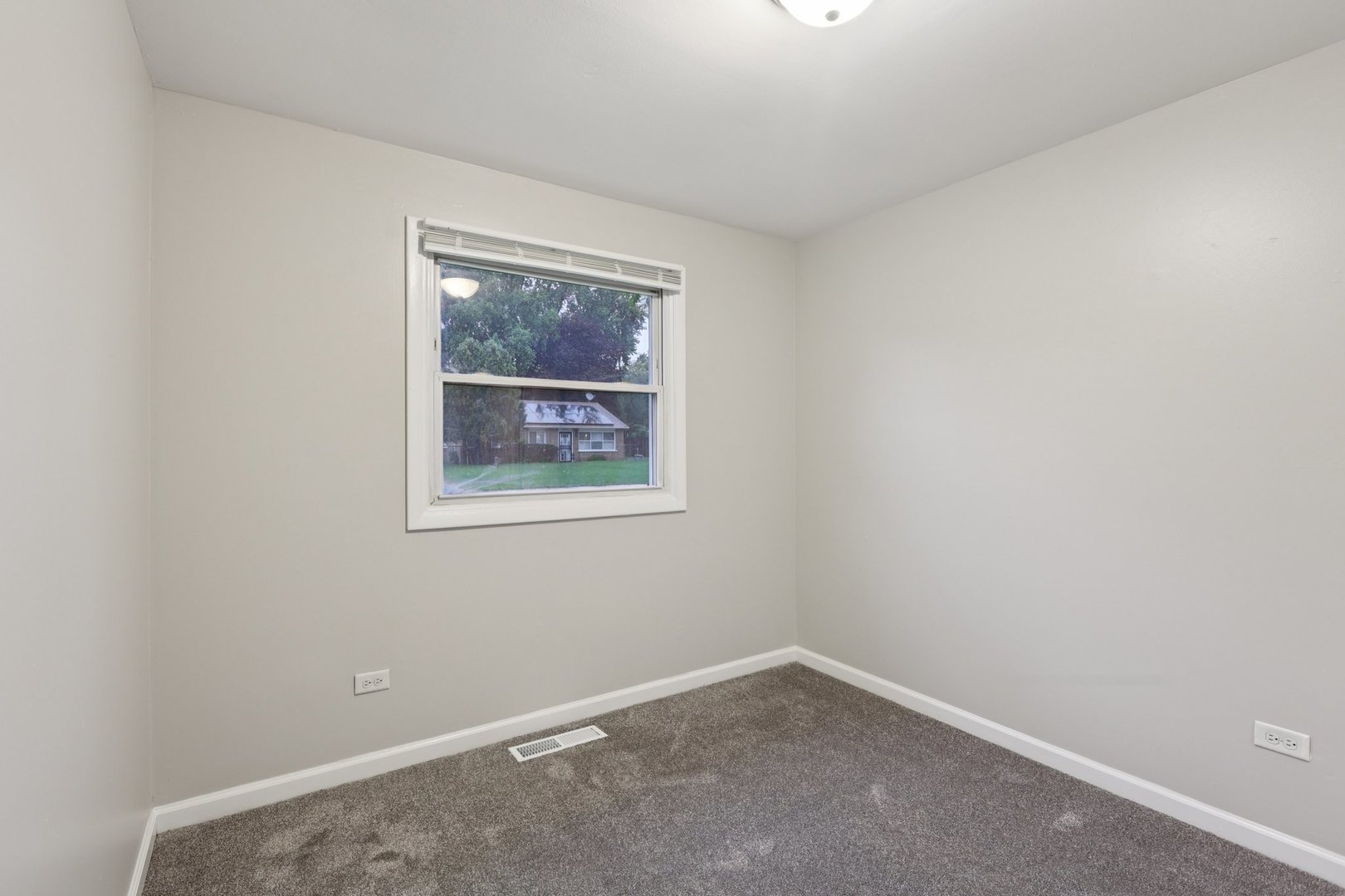 15364 Afton Avenue Markham, IL 60428 - Photo 11 of 23 an empty room with a window