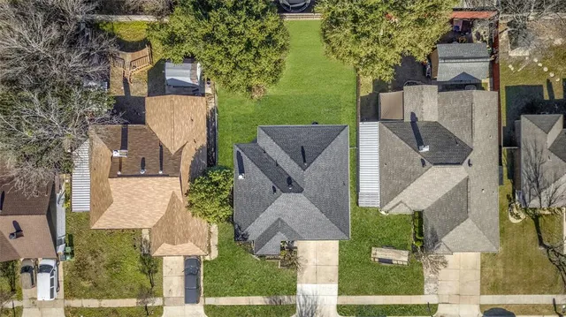 aerial view of a house with a yard and fountain