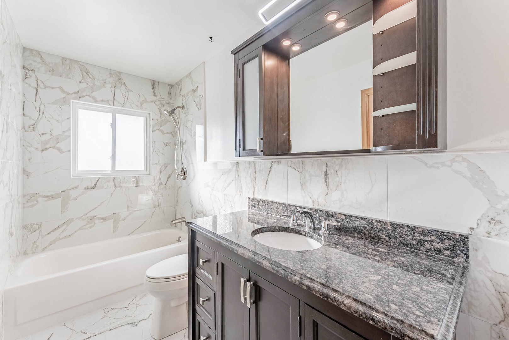 729 Yates Avenue Romeoville, IL 60446 - Photo 9 of 18 a bathroom with a granite countertop sink toilet and shower