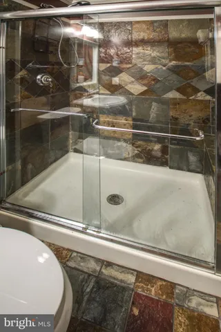 a living room with granite countertop furniture and a fireplace