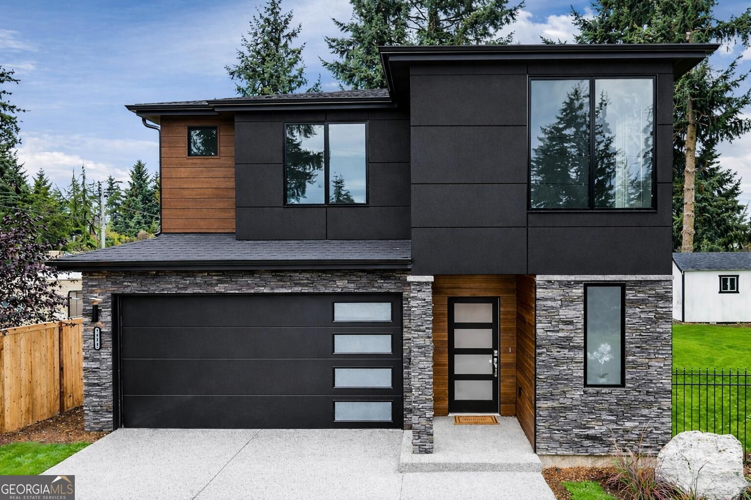 a front view of a house with garage