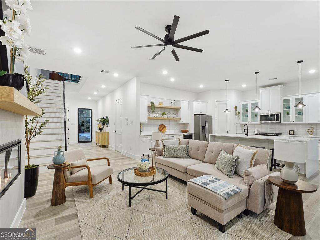 5799 Rockhill Street Austell, GA 30106 - Photo 4 of 5 a living room with furniture and kitchen view