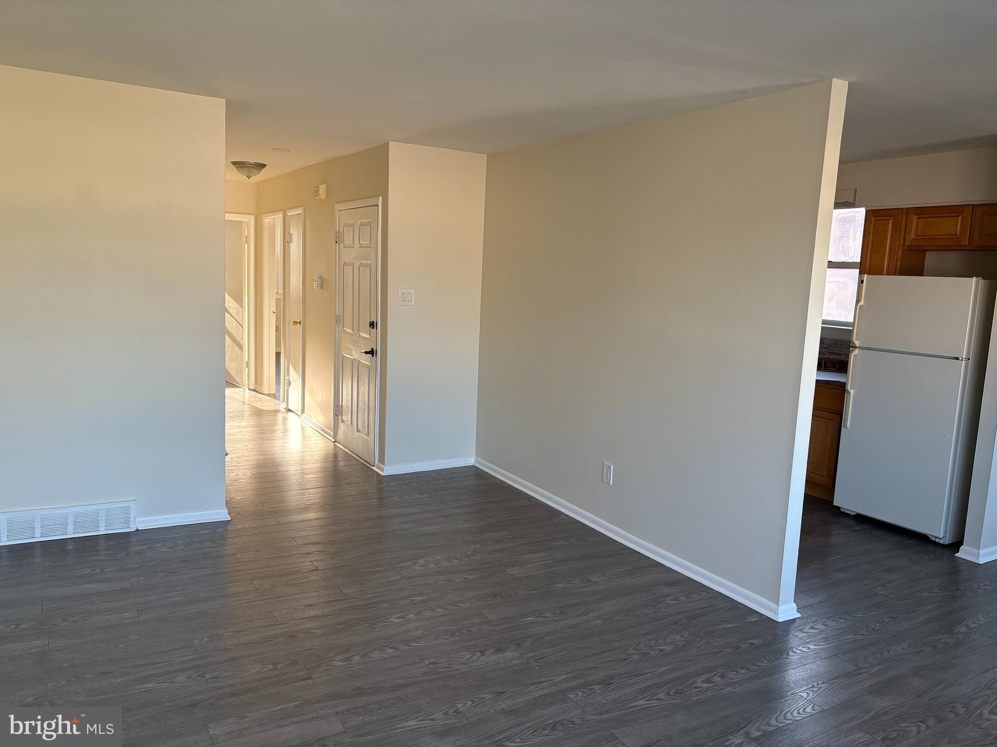 261 Ridgeway Terrace Philadelphia, PA 19116 - Photo 4 of 15 a view of a room with wooden floor and a refrigerator