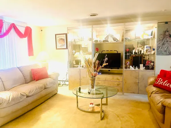 a living room with a couch and a flat screen tv