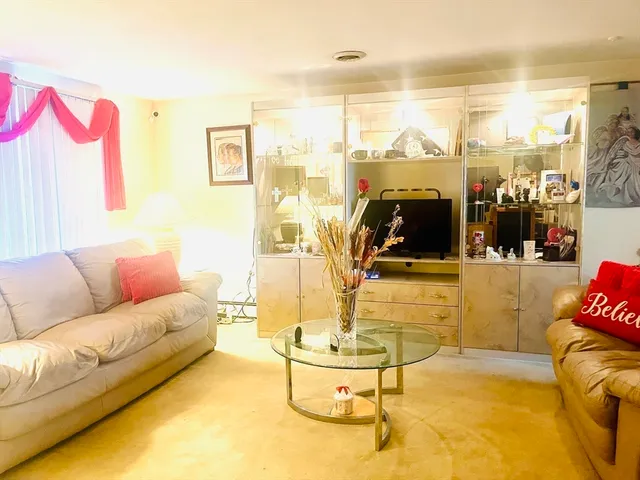 a living room with a couch and a flat screen tv