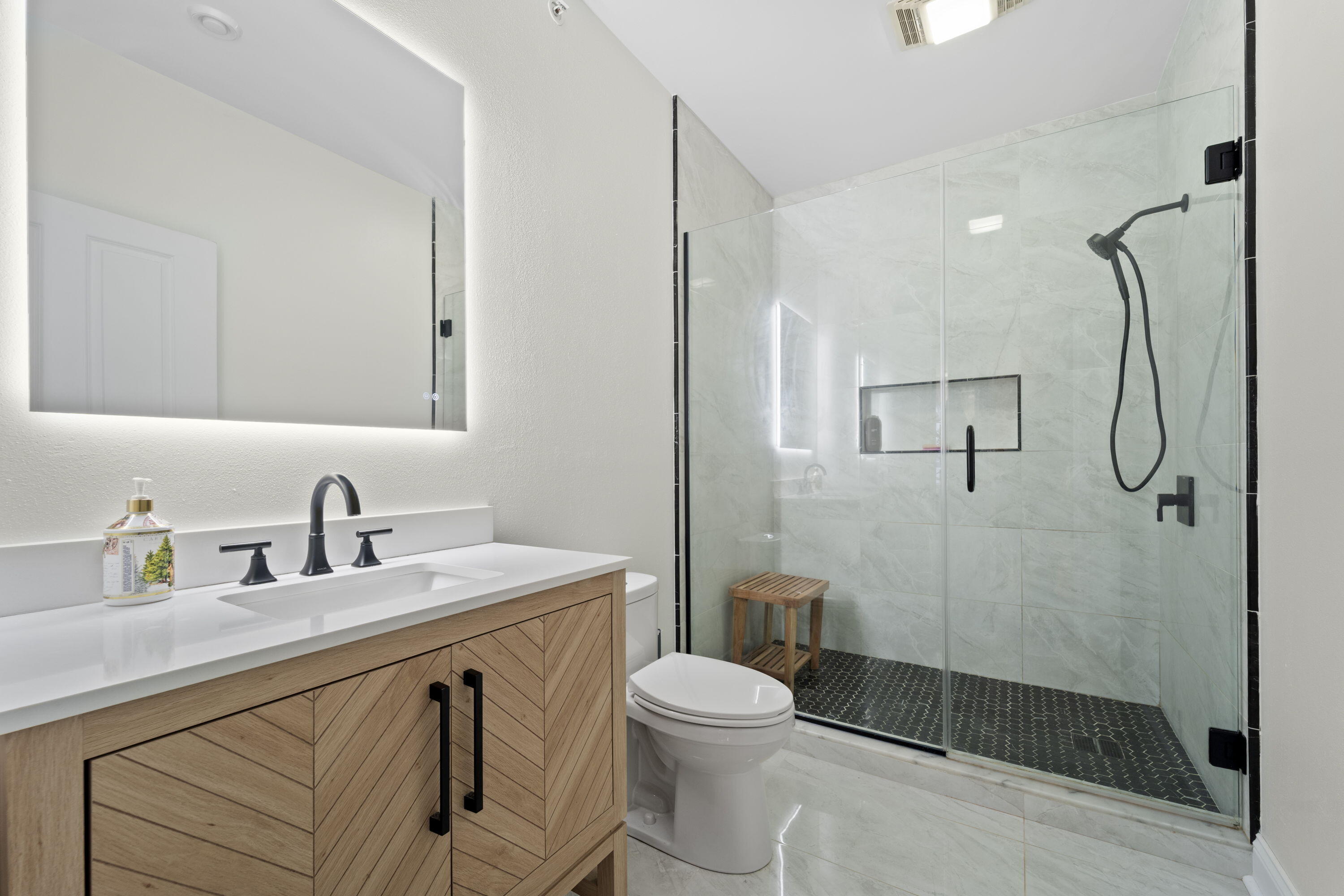 1915 North Water Street, Unit 408 Milwaukee, WI 53202 - Photo 5 of 22 Walk-in Shower, Marble tile floor