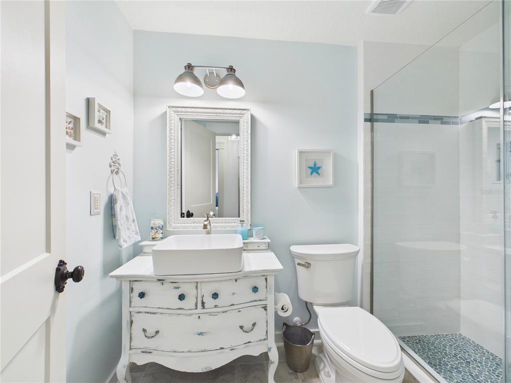 426 Long Cove Road Ormond Beach, FL 32174 - Photo 26 of 73 a bathroom with a sink toilet and shower