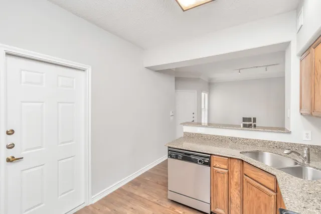 a view of a kitchen counter space and front door