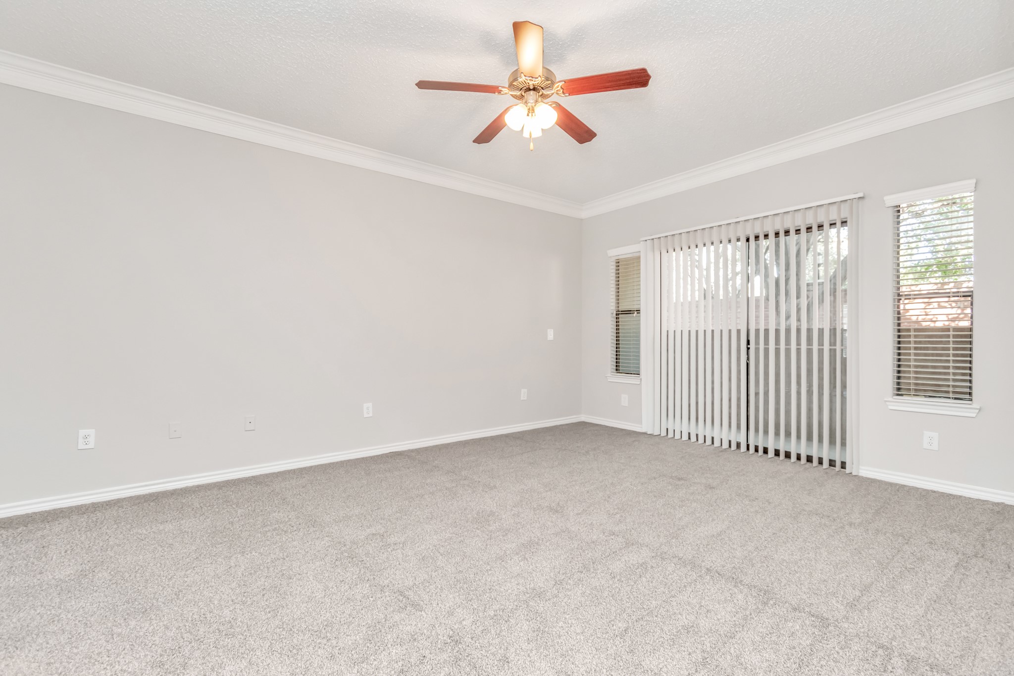 1600 Eldridge Parkway South, Unit 805 Houston, TX 77077 - Photo 18 of 39 an empty room with chandelier fan and windows