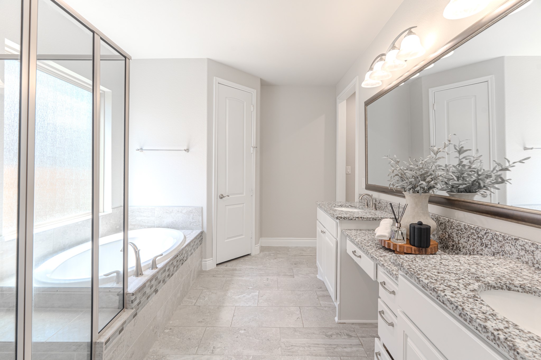27918 Madison Bend Drive Spring, TX 77386 - Photo 26 of 50 a bathroom with a granite countertop sink a mirror and a shower