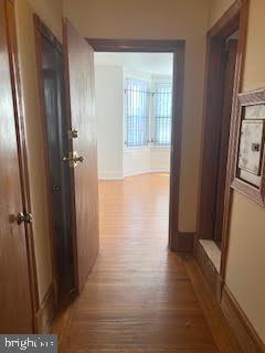 6243 Haverford Avenue, Unit 2 Philadelphia, PA 19151 - Photo 14 of 17 a view of a hallway with wooden floor and a bathroom