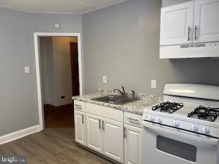 6243 Haverford Avenue, Unit 2 Philadelphia, PA 19151 - Photo 9 of 17 a kitchen with stainless steel appliances granite countertop a sink and cabinets