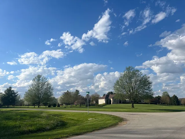 a view of a golf course with a lake