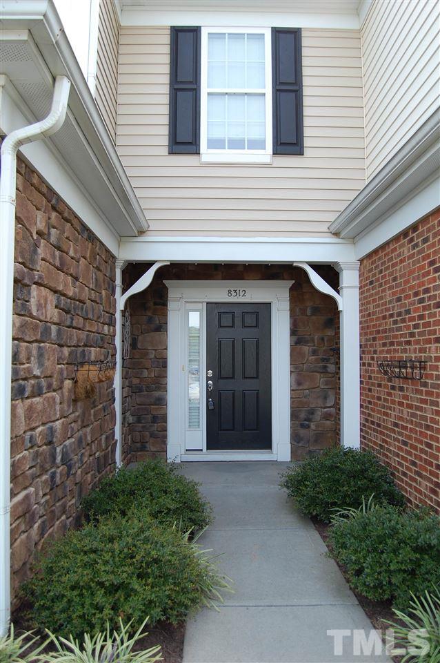 8312 Pilots View Drive Raleigh, NC 27617 - Photo 2 of 10 a front view of a house with a garage