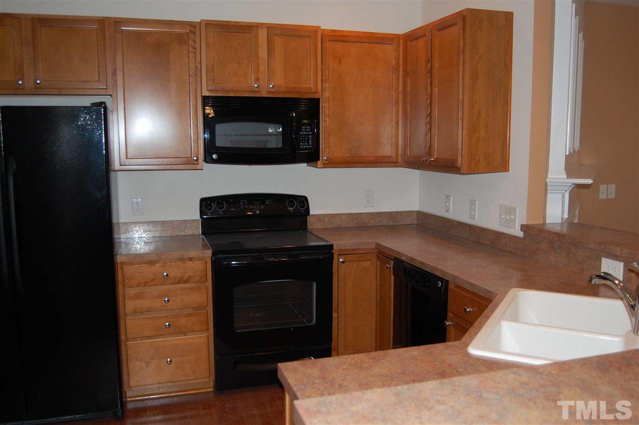 8312 Pilots View Drive Raleigh, NC 27617 - Photo 3 of 10 a kitchen with a sink and a microwave