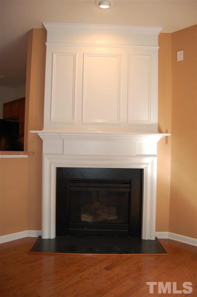 8312 Pilots View Drive Raleigh, NC 27617 - Photo 6 of 10 a living room with a fireplace