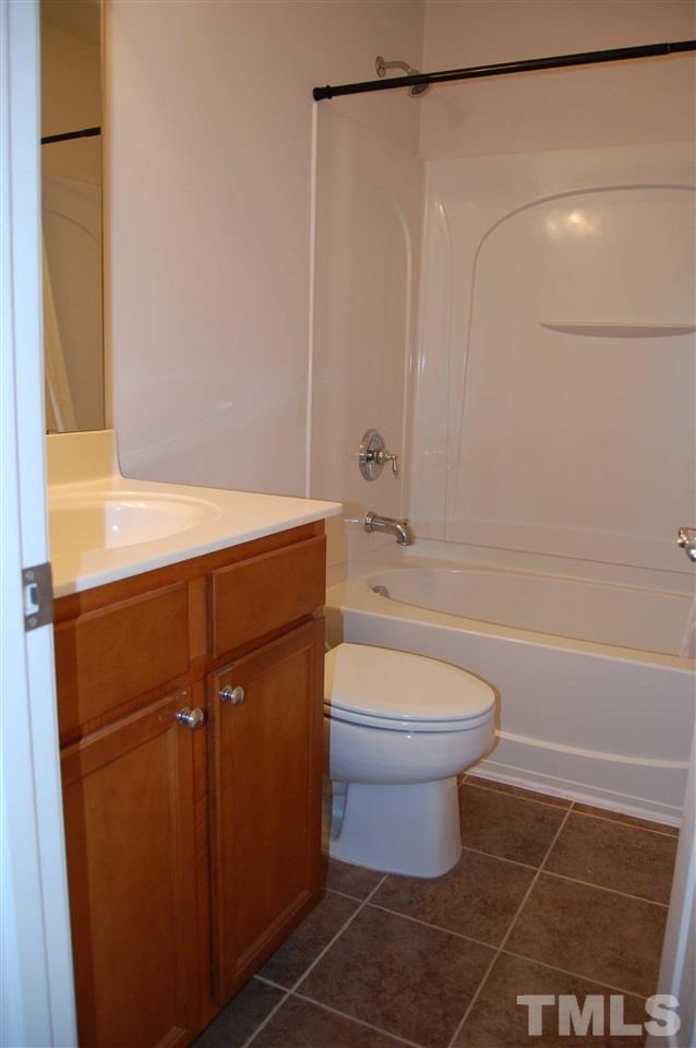 8312 Pilots View Drive Raleigh, NC 27617 - Photo 7 of 10 a bathroom with a sink a toilet and shower