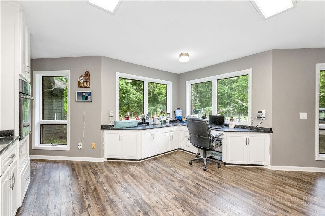939 Don Bare Road Jefferson, NC 28640 - Photo 12 of 49 a living room with kitchen island granite countertop furniture and a large window